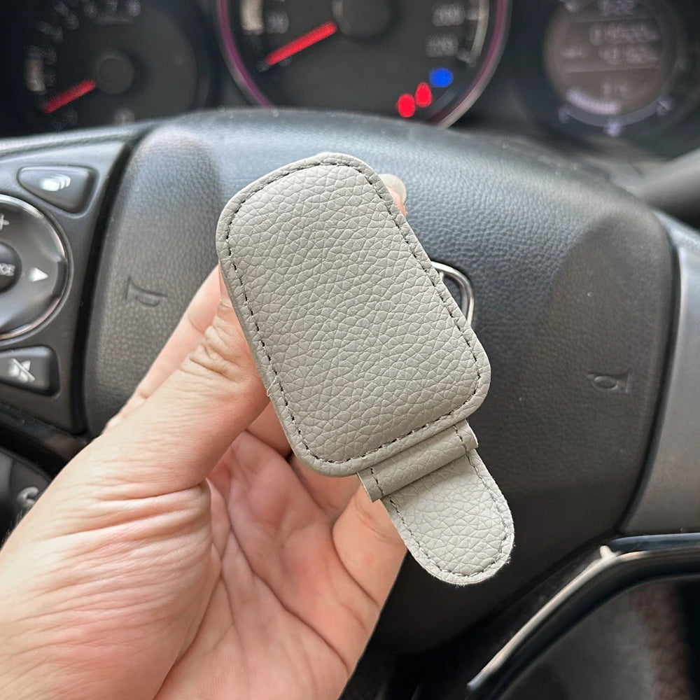 Beige FanzyMarket magnetic car sunglasses holder with foldable leather sun visor clip and space for glasses, cards, and tickets.