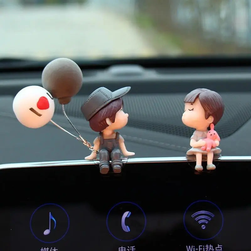 Cute cartoon couple car dashboard figurines with romantic balloon ornaments, ideal for interior decoration and gifts.