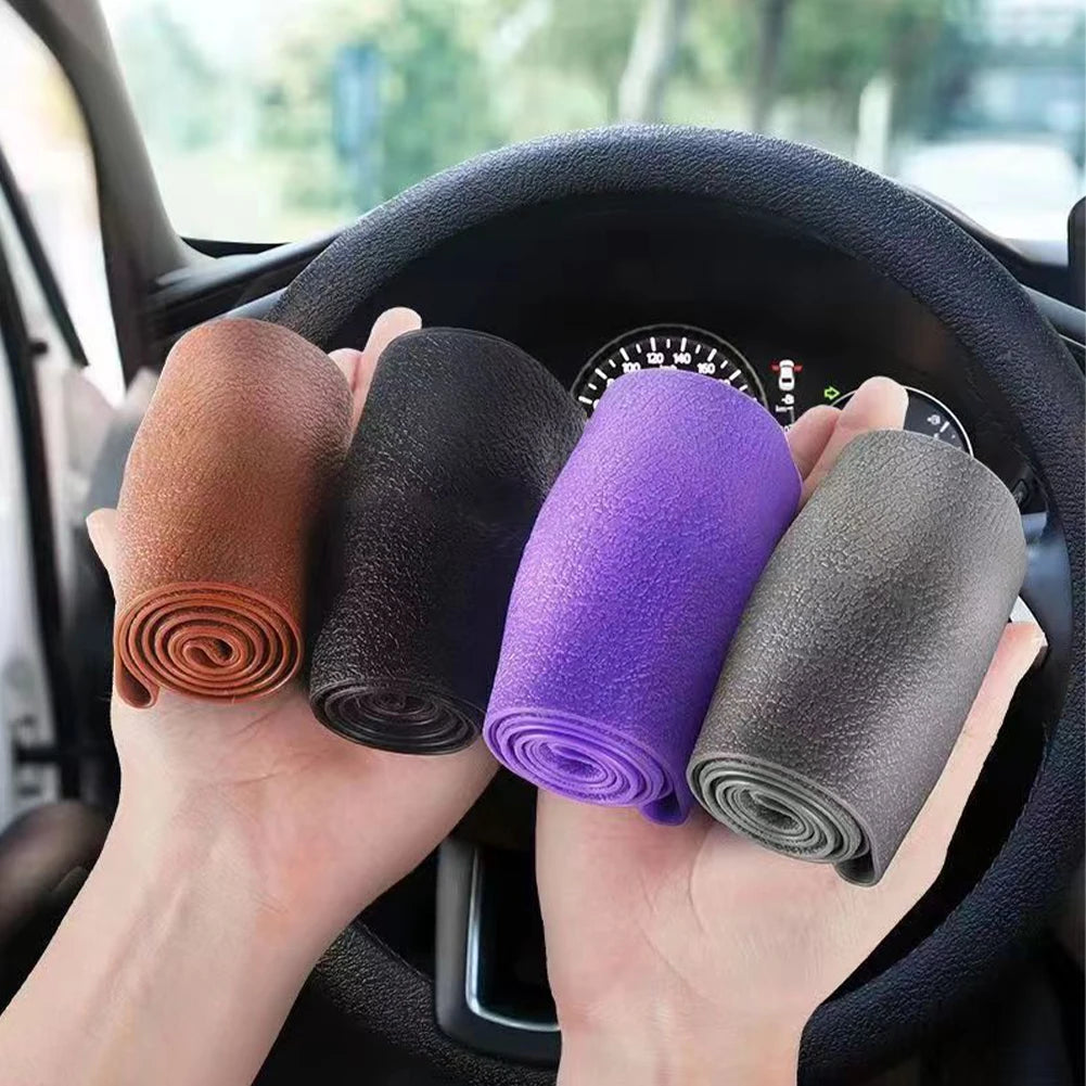 FanzyMarket universal silicone steering wheel cover with elastic, non-slip grip fits 36-40 cm (14-16 in) wheels in vibrant colors.