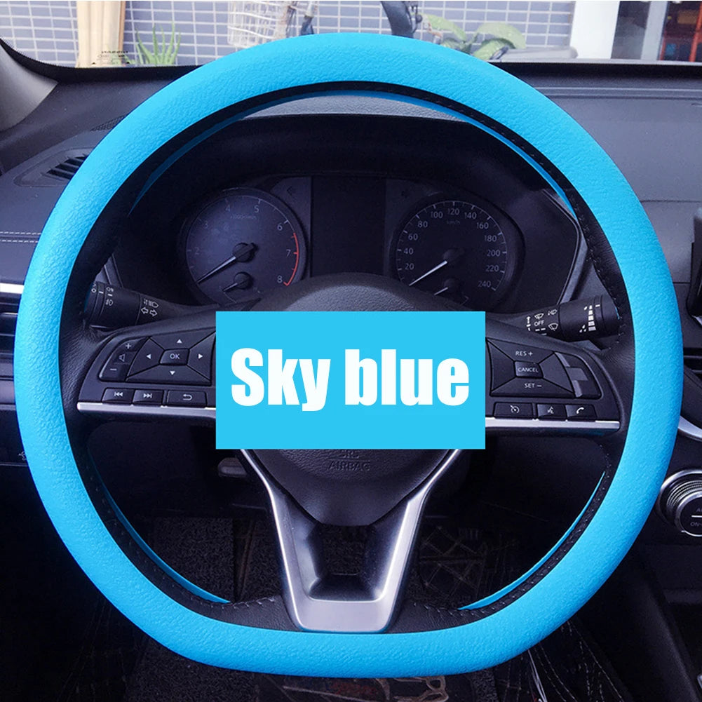 Purple FanzyMarket silicone steering wheel cover with elastic, non-slip grip, fits 36-40 cm (14-16 in) car steering wheels.