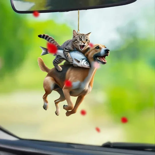 Cute cat-shaped rearview mirror ornament hanging inside a car, decorative pendant for automotive interior decor.