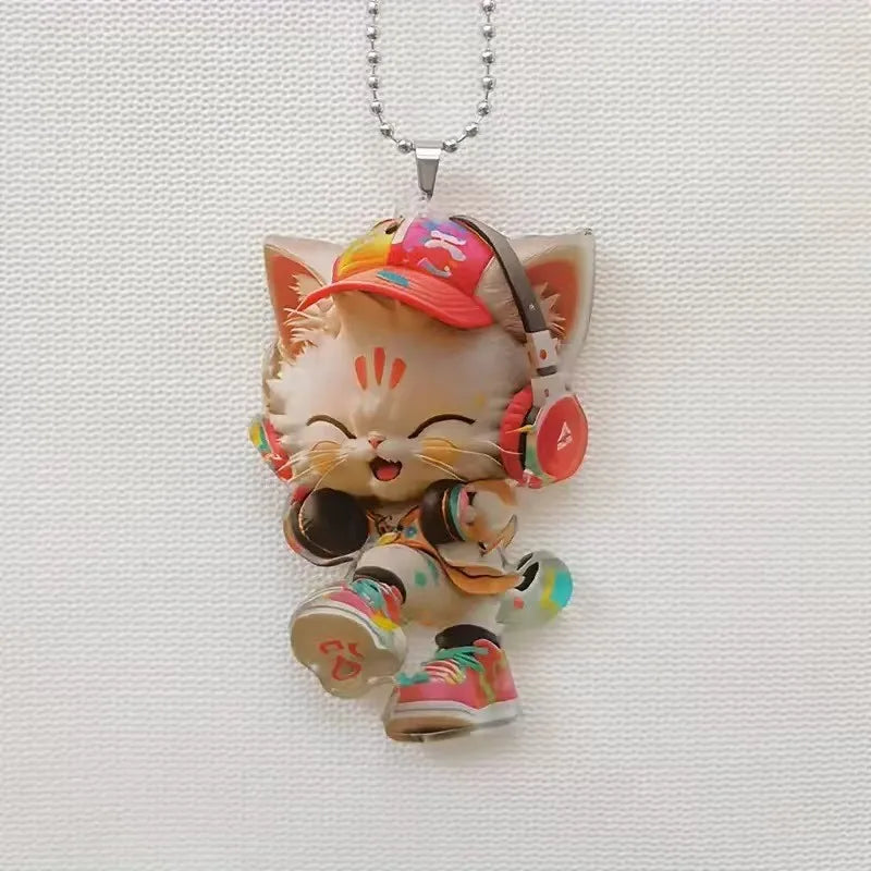 Cute cat-shaped rearview mirror ornament hanging from a car interior, decorative pendant for auto interior decor.