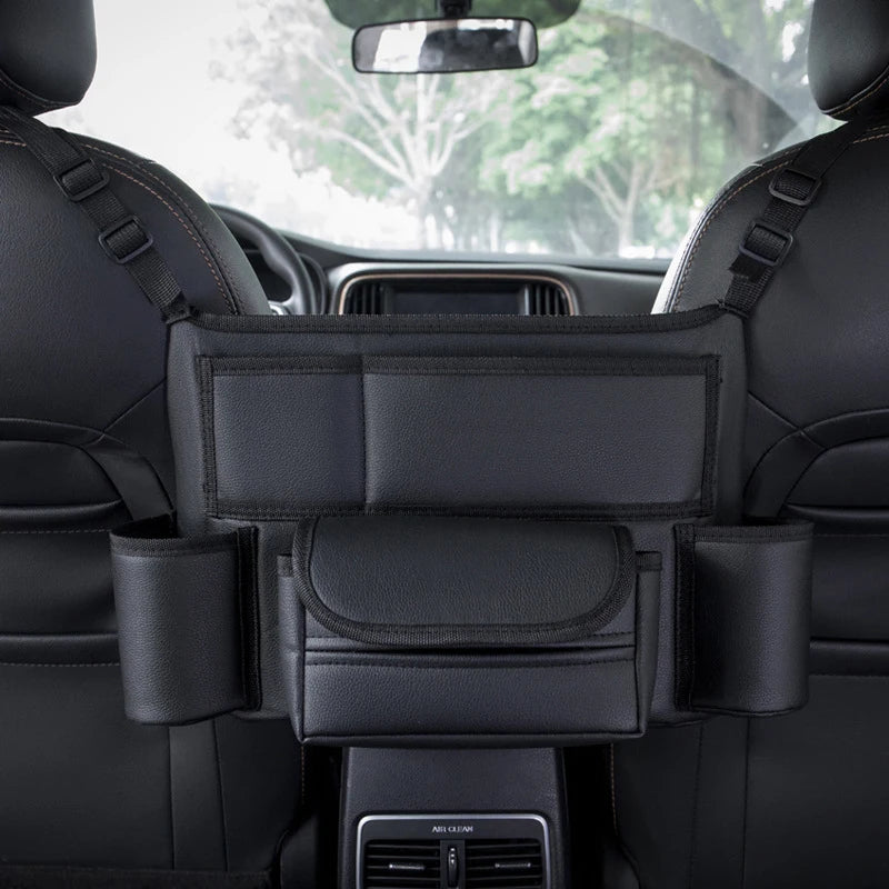 Leather car seat middle hanger organizer by FanzyMarket with large capacity, tissue and cup pockets, for interior auto and moto use.