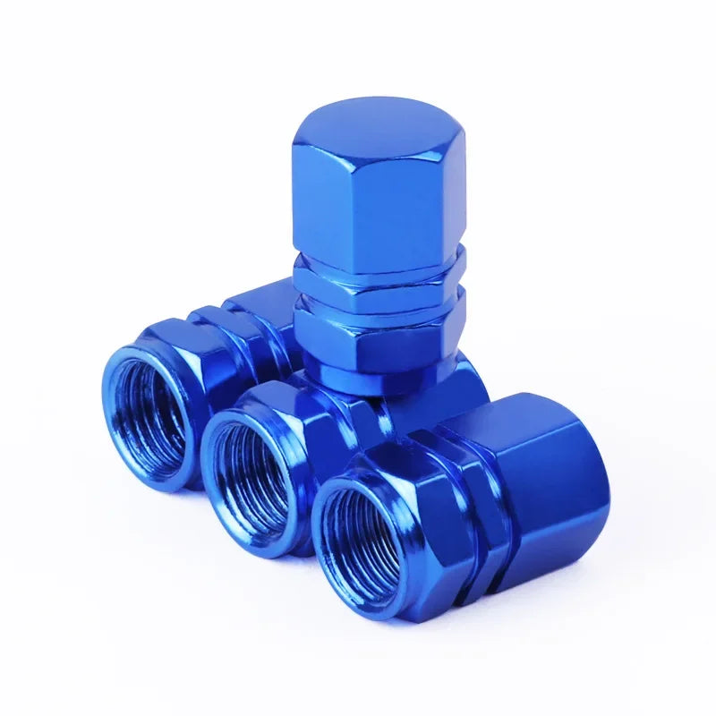 Red aluminum alloy tire valve stem caps for car, motorcycle, and bicycle, dustproof and durable for automotive wheels and tires.