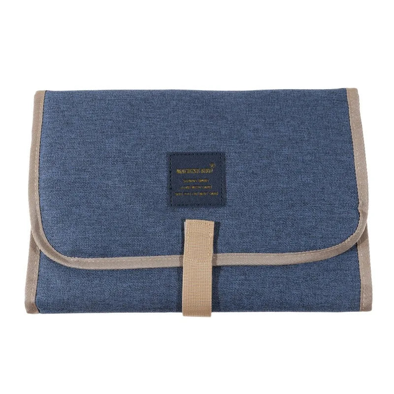 Light gray foldable waterproof baby changing pad by FanzyMarket, portable diaper mat for newborns and toddlers in Oxford fabric.