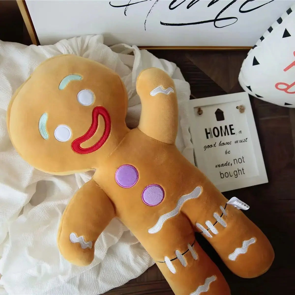 FanzyMarket gingerbread man plush toy, soft stuffed cookie doll for room decor and gifts, measuring 27-30cm.