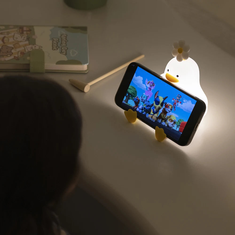 FanzyMarket cute duck LED night light for kids, rechargeable silicone touch lamp with adjustable brightness and USB connection.