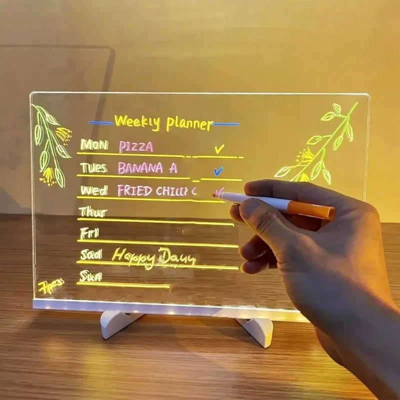 FanzyMarket light-up acrylic message board with glowing drawing lamp and 7 colorful pens for kids, suitable for rewritable creative fun.
