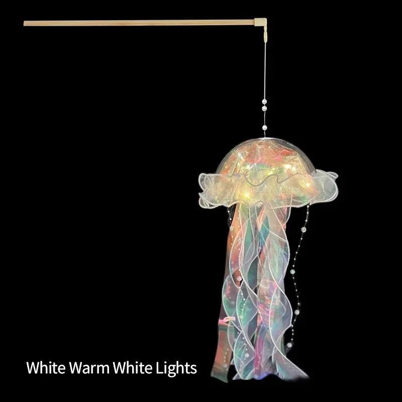 Purple Jellyfish LED Lantern Night Light hanging with ocean mermaid design, ideal for kids' bedroom or party decor.