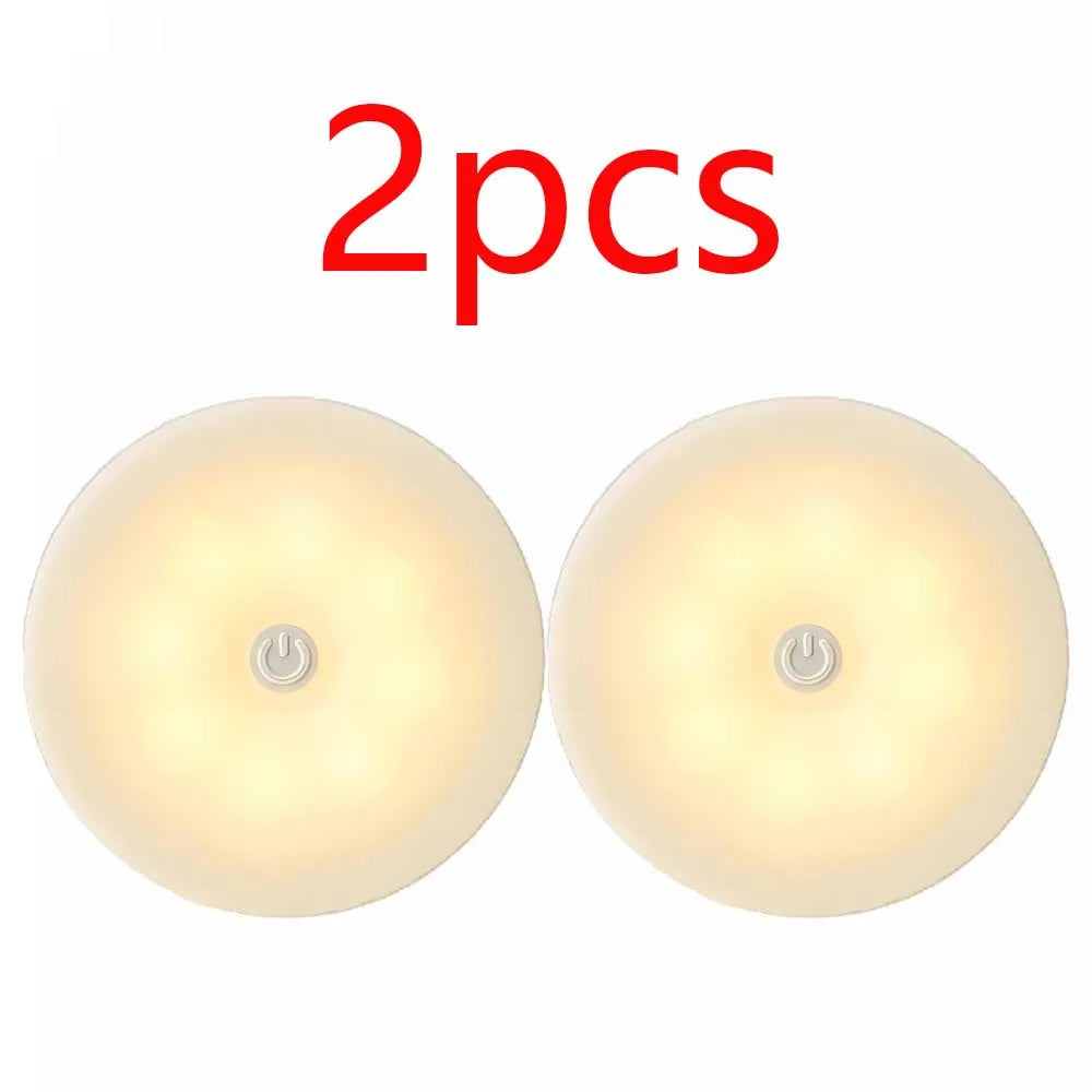 Two FanzyMarket LED motion sensor night lights with warm white light, USB rechargeable, magnetic, auto on/off, ideal for decor and lighting.