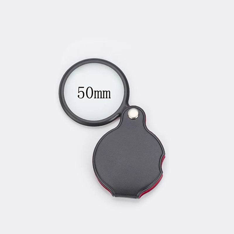 FanzyMarket foldable pocket magnifier with 6x/8x glass lens, 50mm & 60mm sizes, leather case, ideal for reading and jewelry inspection.