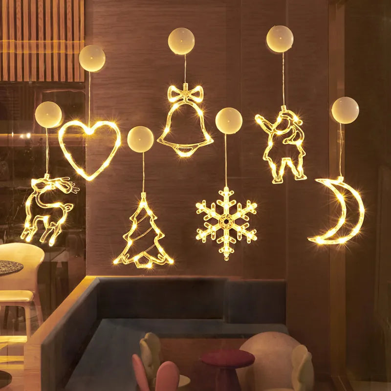 FanzyMarket battery-operated Christmas LED snowflake and Santa hanging window ornaments in warm white holiday decor, string fairy lights.