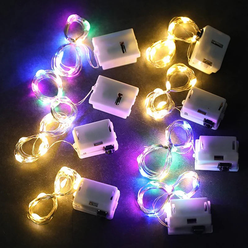 FanzyMarket button battery LED fairy string lights in pink, 2m length, 20 warm white, white, blue, or multicolor LEDs for indoor outdoor decor.