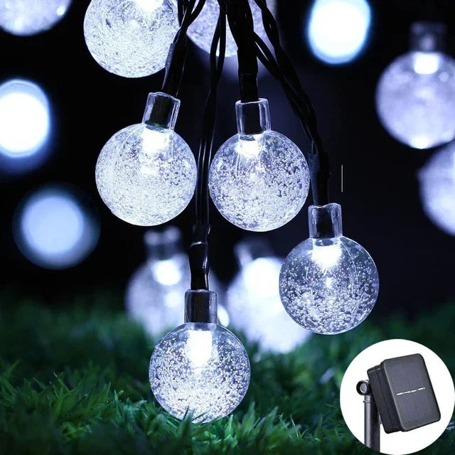 FanzyMarket solar crystal globe LED string lights with 100 warm LED bulbs, IP65 waterproof for garden, patio, and outdoor party decor.