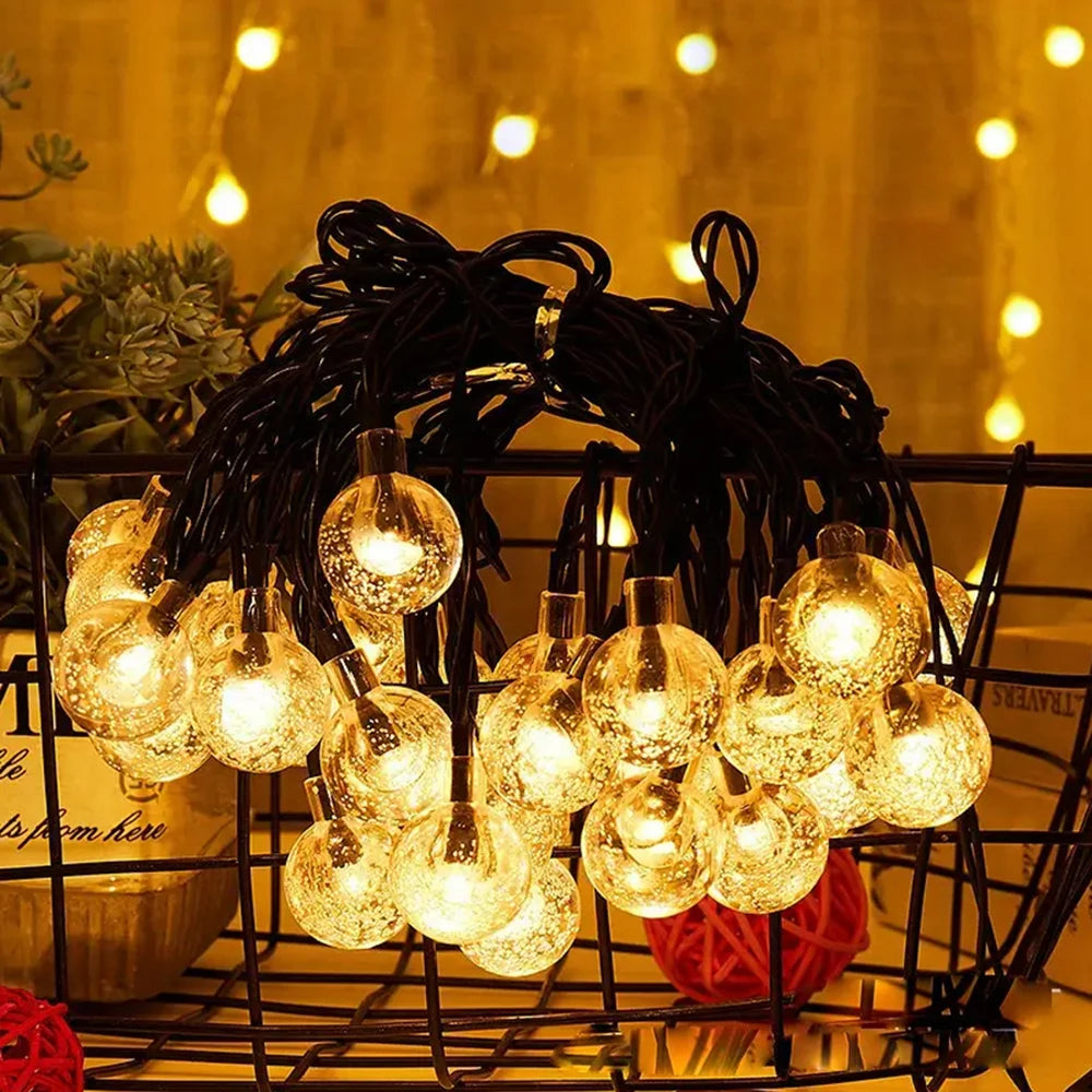 FanzyMarket solar bubble ball string lights with 100 LEDs, waterproof outdoor fairy lights in warm white, 8 lighting modes for garden decor