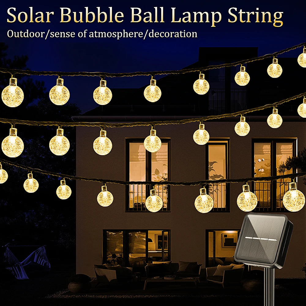 FanzyMarket solar bubble ball string lights with 100 LEDs, waterproof outdoor fairy lights in warm white, perfect for garden and party decor.
