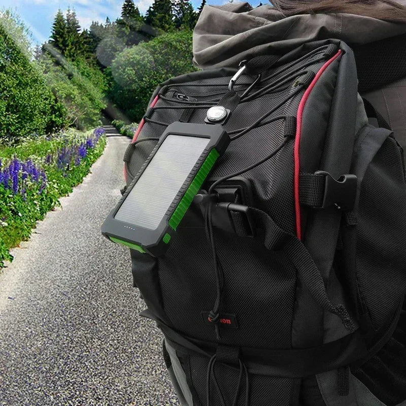 FanzyMarket 100000mAh solar power bank with USB-C, waterproof design, SOS flashlight, LED lamp, portable electronics charger.