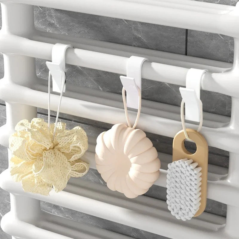 FanzyMarket radiator towel hooks for heated rails, 2-pack or 6-pack, plastic hangers for towels, clothes, and scarves on bathroom radiator.