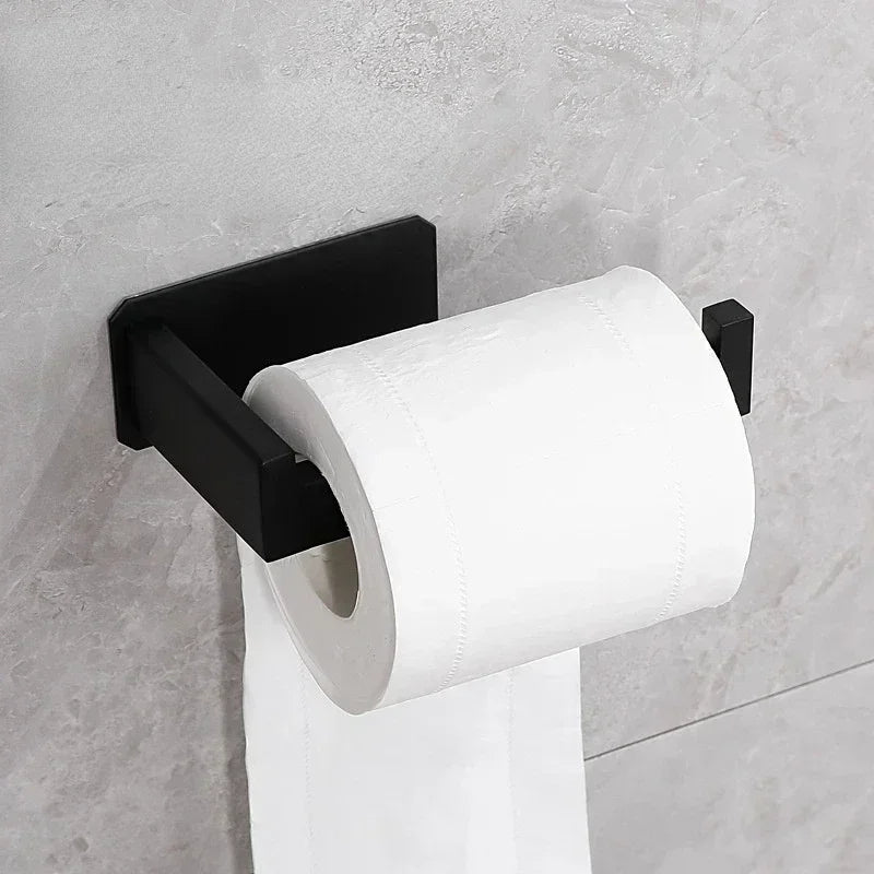 Matte black stainless steel toilet paper holder with self-adhesive wall mount, no-drill installation, suitable for bathroom use.