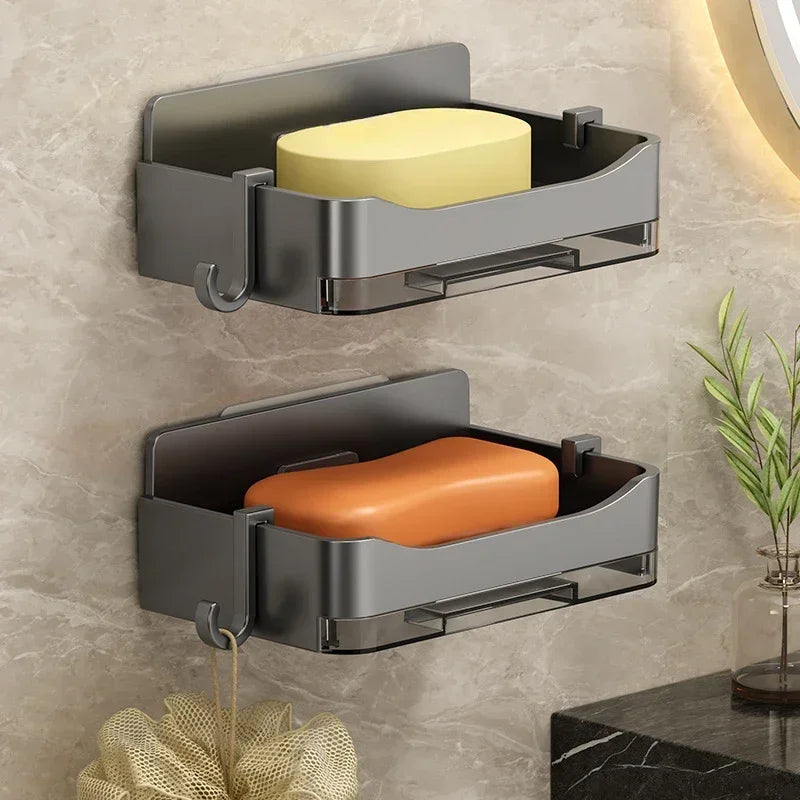 Gray wall-mounted soap and sponge holder by FanzyMarket, double-drain plastic soap dish for bathroom organization.