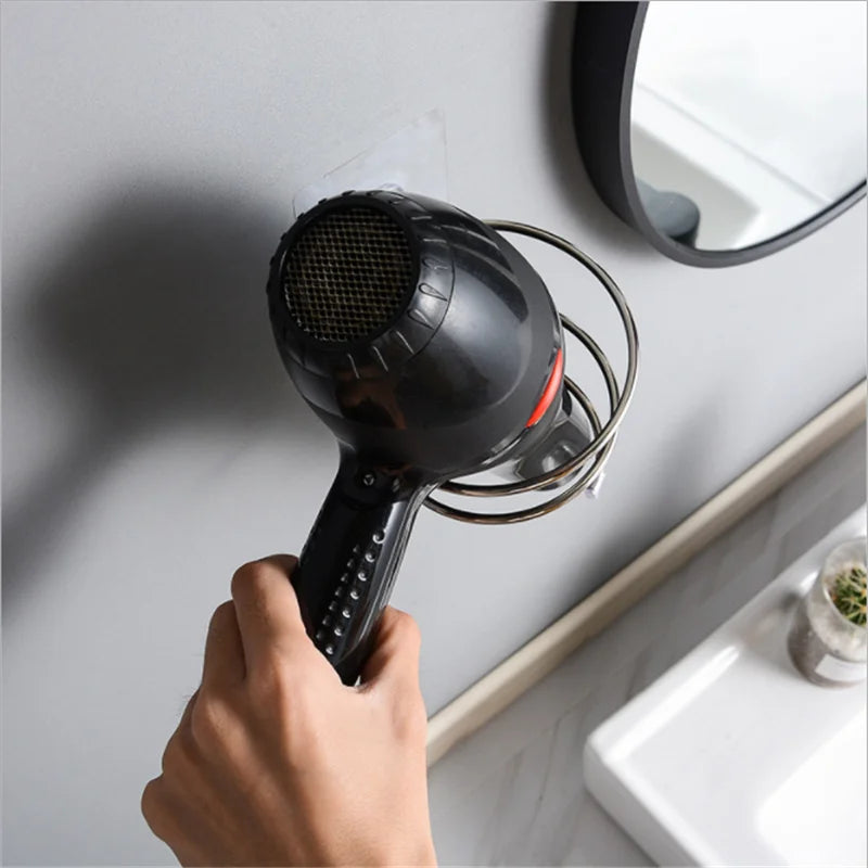 Yellow stainless steel wall-mounted hair dryer holder with spiral stand and nail-free adhesive in 12x10 cm size.