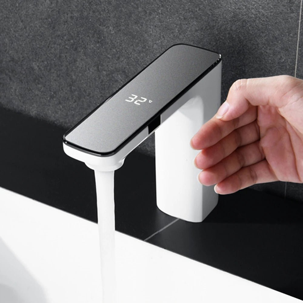 White deck-mount bathroom basin faucet by FanzyMarket with single handle and ceramic valve for hot and cold water.