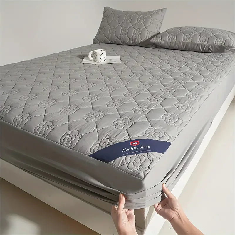 Dark green waterproof fitted mattress protector from FanzyMarket, breathable and soft deep-pocket cover for single or double beds.