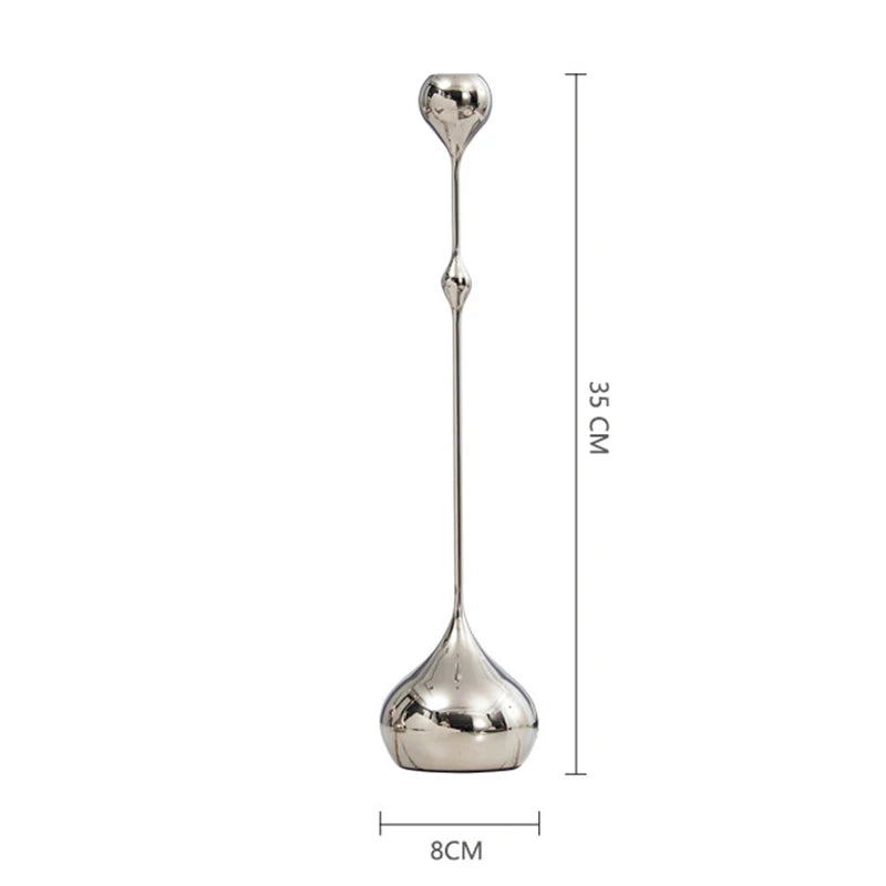 Silver stainless steel candle holder with a sleek metal design, perfect for home, dining, or wedding decor.