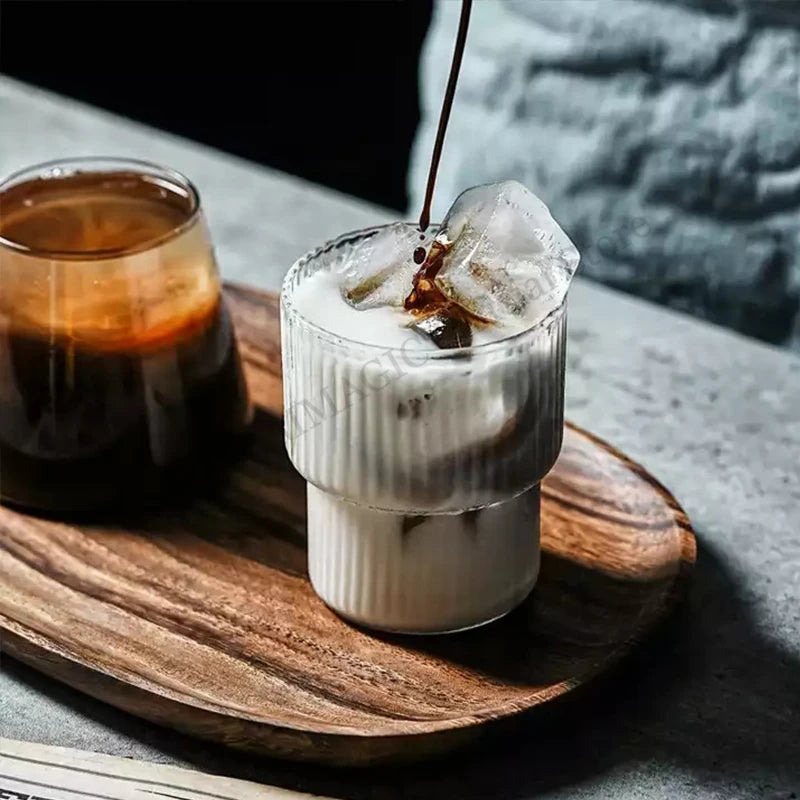 Clear ribbed borosilicate glass latte mug with handleless design, 200ml or 300ml capacity, heat-resistant for coffee and beverages.