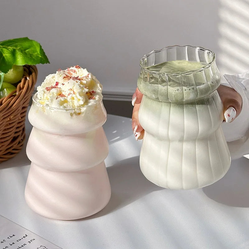 Clear tall glass coffee mug by FanzyMarket, perfect for iced coffee, milk, juice, and cocktails, with a sleek, transparent design.
