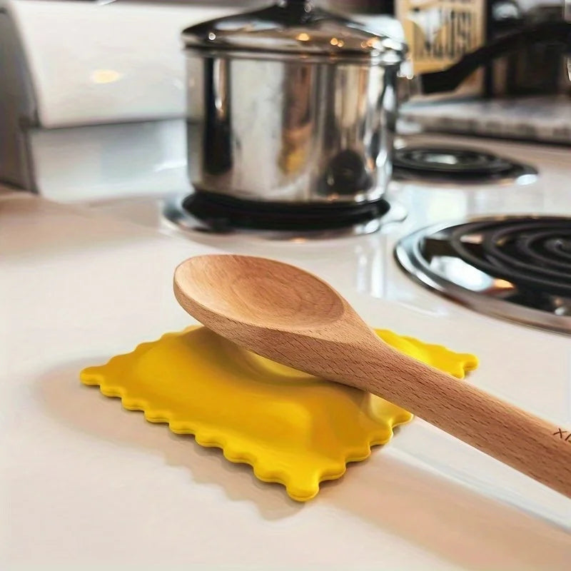 FanzyMarket cartoon biscuit-shaped silicone spoon rest, heat-resistant and non-slip, for kitchen use.