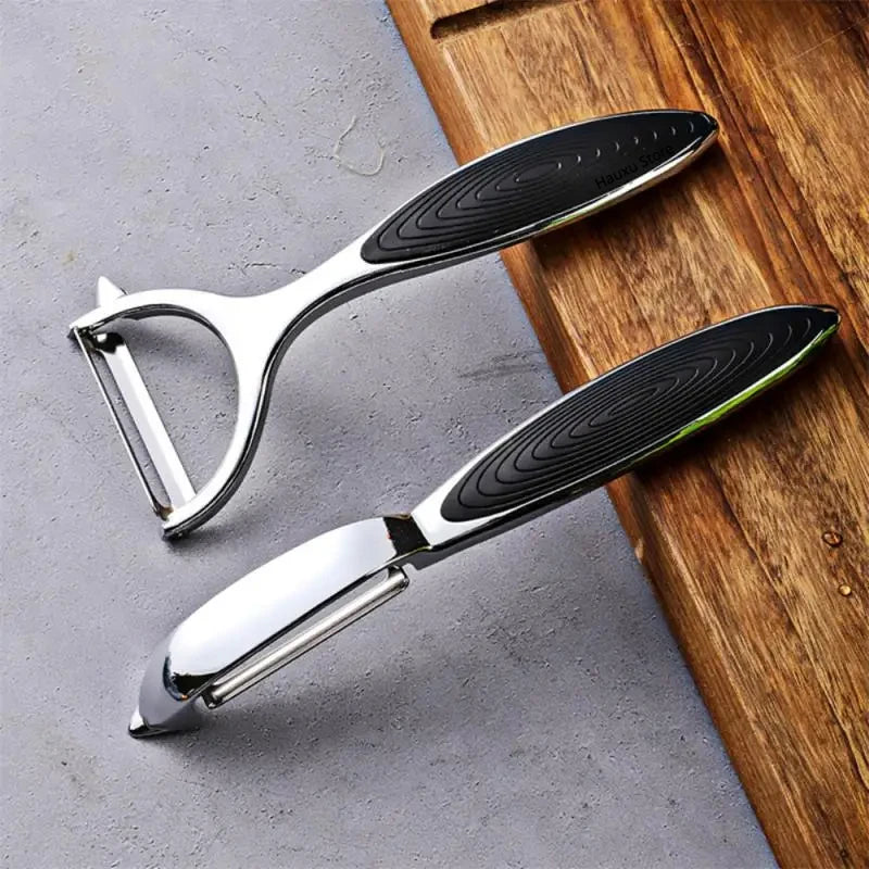 FanzyMarket stainless steel vegetable and fruit peeler with Y and I blades, handheld grater and potato peeler for kitchen use.