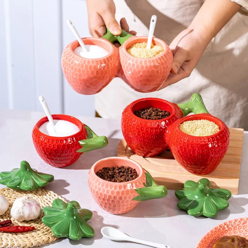 Ceramic strawberry-shaped oil and vinegar cruet by FanzyMarket, fruit-inspired kitchen jar for salt, sugar, or soy sauce.