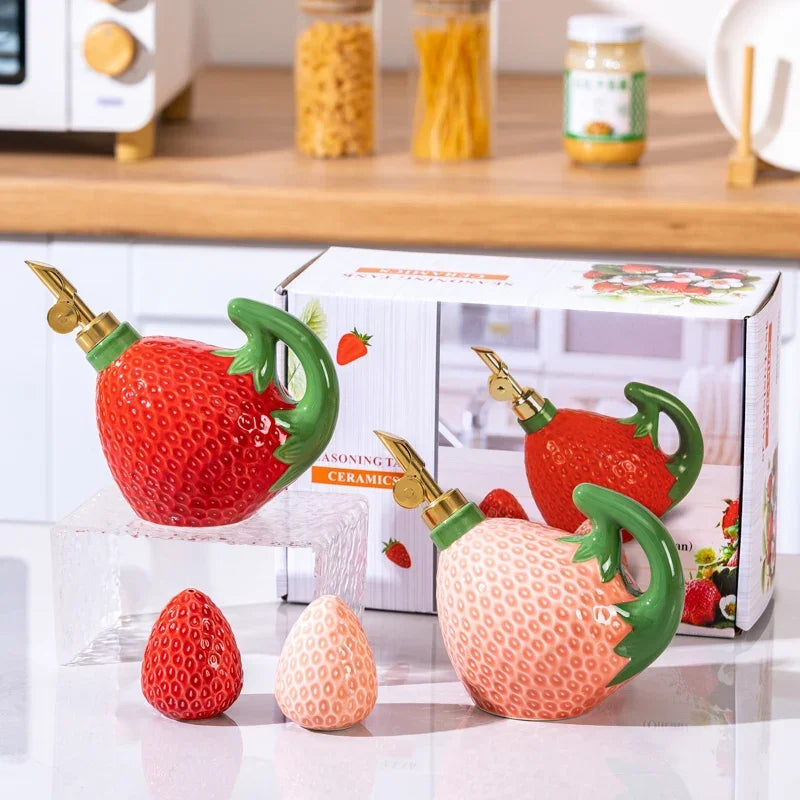 Ceramic strawberry-shaped oil and vinegar cruet by FanzyMarket, fruit-shaped seasoning jar for salt, sugar, or soy sauce in kitchen.