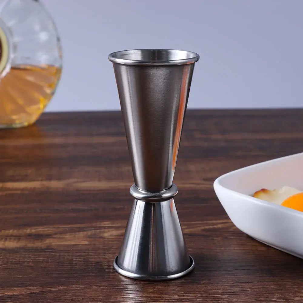 FanzyMarket dual-sided stainless steel jigger for precise 30ml and 50ml cocktail measurements, bar tool for home mixing.