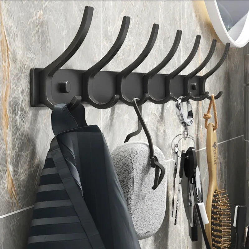 FanzyMarket 6-peg folding wall hooks in black and white, aluminum nail-mount towel and coat rack for home storage and organization.