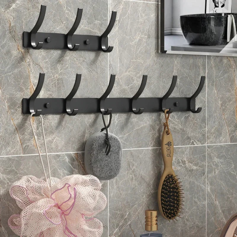 FanzyMarket 6-Peg Folding Wall Hooks in black and white, aluminum nail-mount towel and coat rack, ideal for home organization.