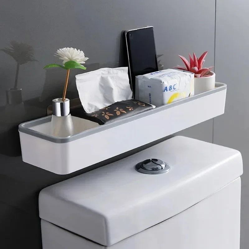 White over-toilet wall shelf organizer by FanzyMarket, adhesive no-drill corner bathroom storage rack for bathroom organization.