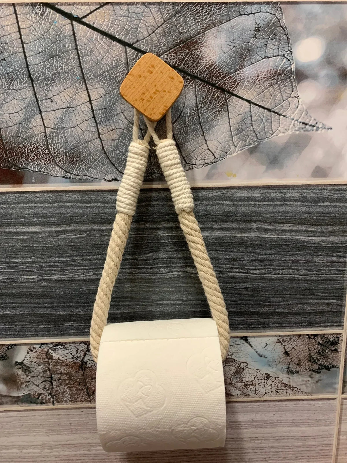 FanzyMarket nail-free wall-mounted paper towel and toilet roll holder with rope design, ideal for home storage and organization.