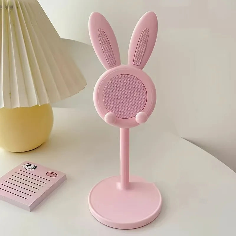 Cute cartoon bunny adjustable desktop phone and tablet stand by FanzyMarket, universal smartphone holder for office and tech use.