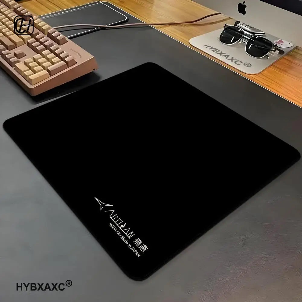 FanzyMarket waterproof gaming mouse pad with anti-slip, anti-sweat cloth surface and rubber base in multiple sizes for office and gaming.