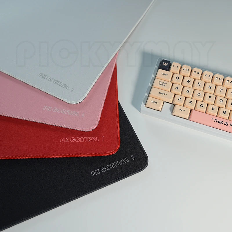 Black professional gaming mouse pad by FanzyMarket with anti-slip rubber base, stitched edges, and washable surface for speed and control.