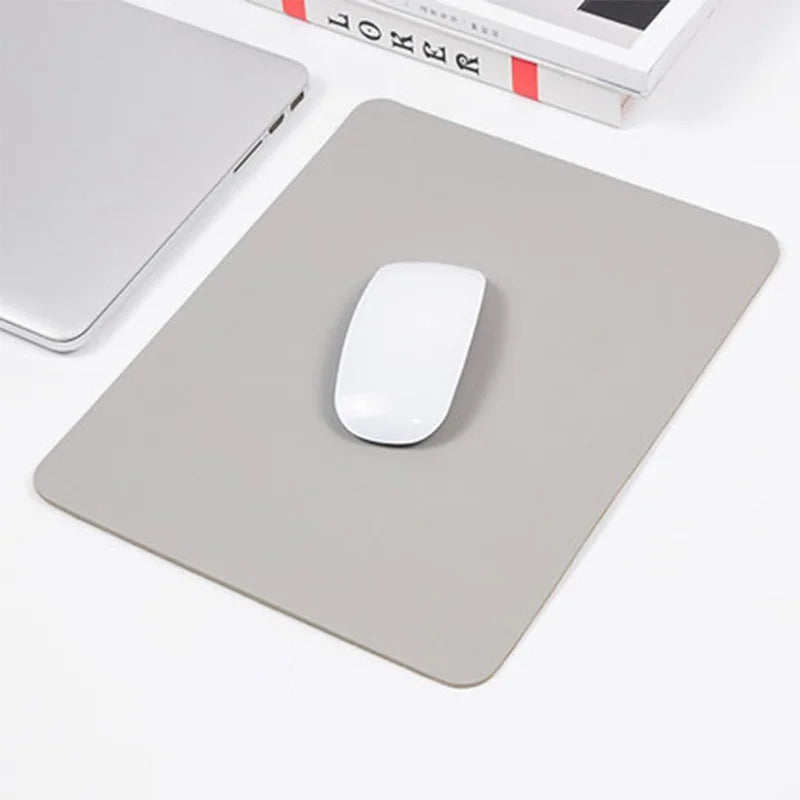 Pink PU leather mouse pad from FanzyMarket, non-slip, waterproof, and anti-scratch desk mat for PC, laptop, and gaming setups.