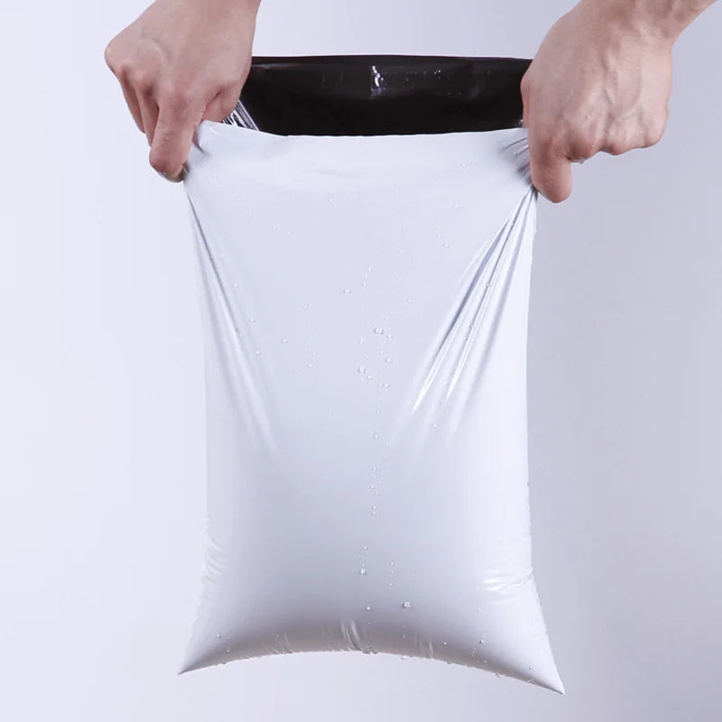 50-pack white self-adhesive poly mailers, 10x13 inches, tear-resistant shipping bags for office and tech shipping by FanzyMarket