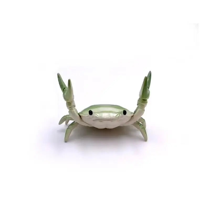 Green mini crab pen holder from FanzyMarket, a cute desktop organizer for pens and stationery.