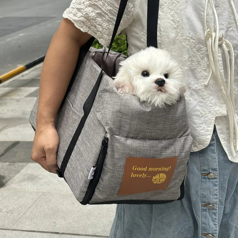 Grey portable car dog seat bed for small dogs and cats, waterproof, removable, with soft cushioning for travel comfort.