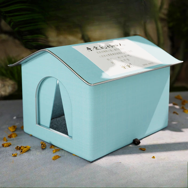 Blue waterproof foldable pet cave bed for small dogs and puppies, insulated, plush interior, washable, ideal for outdoor winter use.