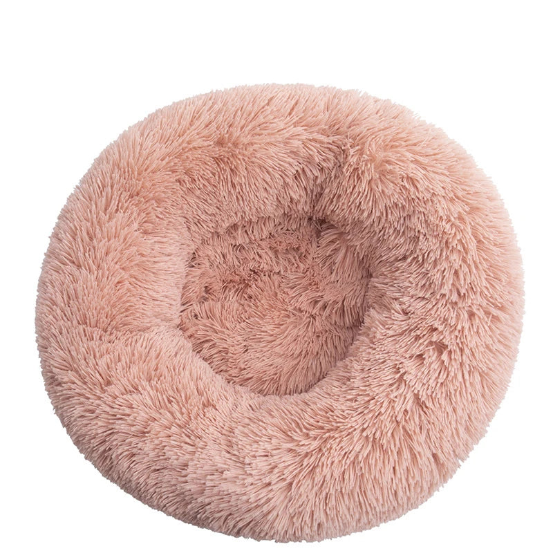 Pink orthopedic donut pet bed by FanzyMarket, soft plush round bed for dogs and cats, calming, washable, anti-anxiety cushioning.