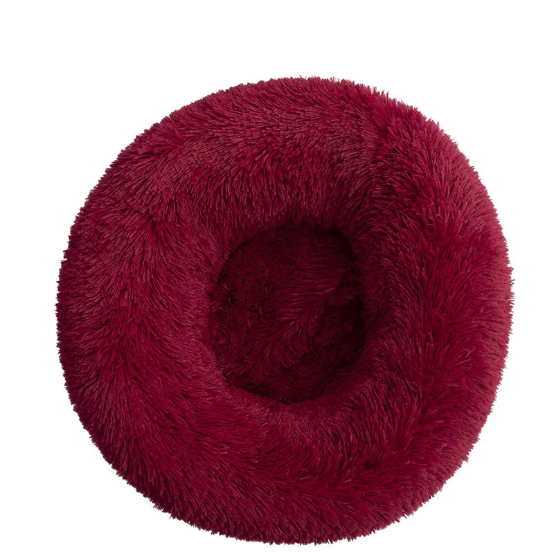 Pink orthopedic donut pet bed by FanzyMarket, soft washable plush bolster for dogs and cats, calming anti-anxiety round sofa.