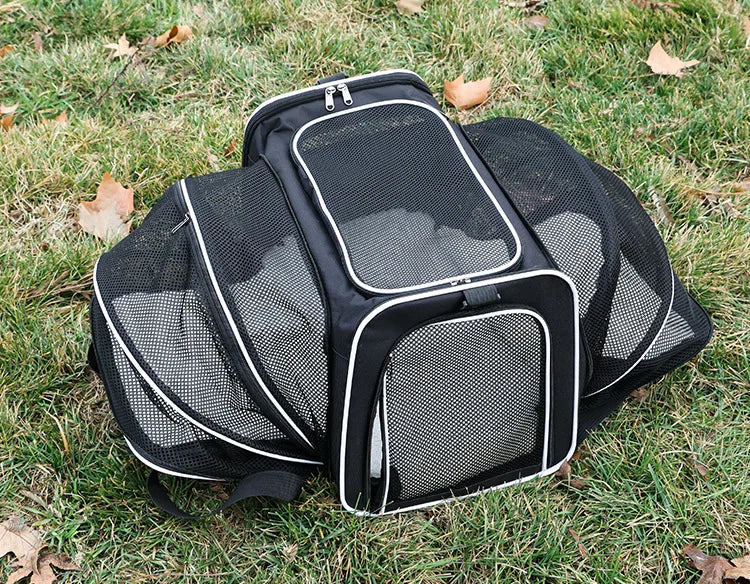 FanzyMarket foldable mesh pet carrier for cats and small dogs, soft-sided, breathable, expandable travel tote with handle.